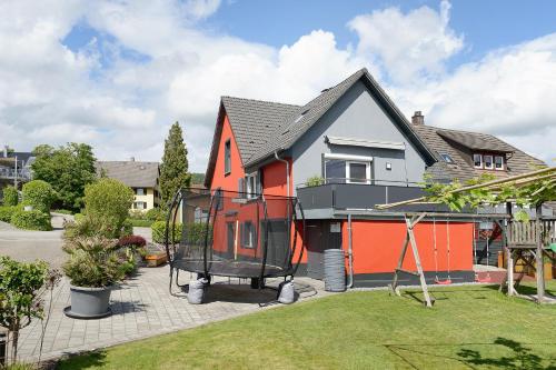 a house with an orange and black house at Ferienhaus Sieger in Salem