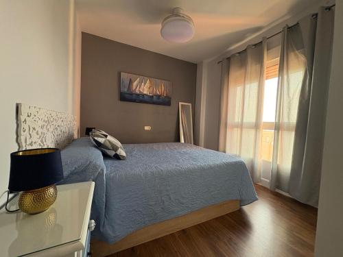 a bedroom with a bed and a window at HondaMar in Playa Honda