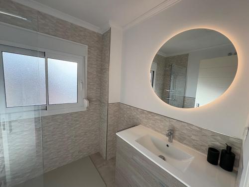 a bathroom with a sink and a mirror at HondaMar in Playa Honda