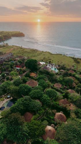 an aerial view of a resort near the ocean at La Joya Balangan Resort in Jimbaran