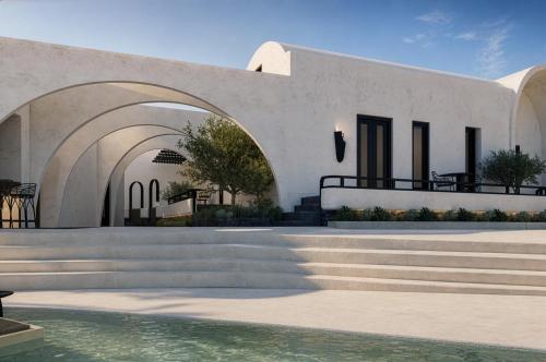 a white building with stairs next to a pool of water at Mamay Hotel in Fira