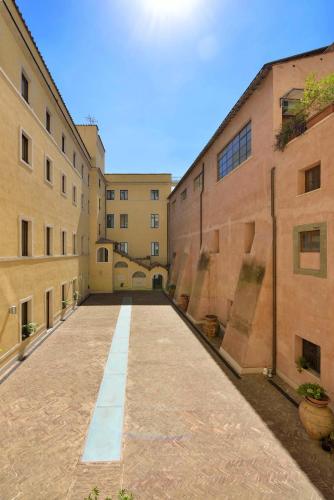 an empty alley between two buildings in a city at Casa I Cappuccini in Rome