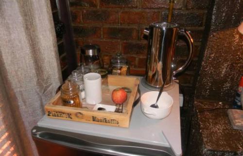 a counter top with a blender and a box on it at La Postma House in Postmasburg