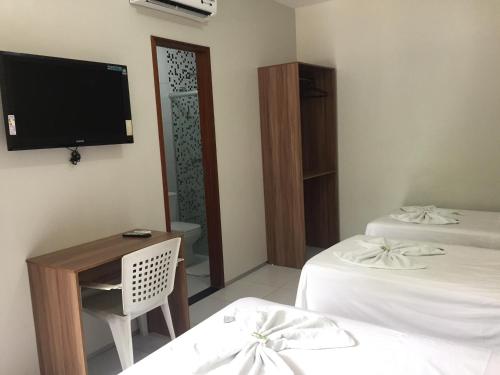 Una cama o camas en una habitación de Pousada Lagoa Seca