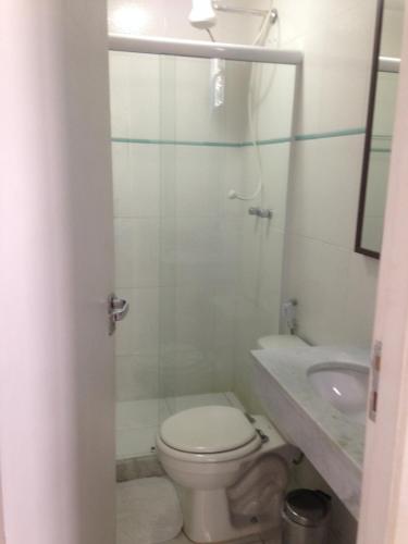 a bathroom with a toilet and a sink at Brasileranza Hostel in Niterói