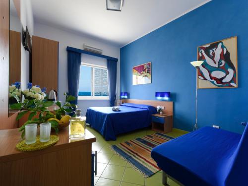 Posteľ alebo postele v izbe v ubytovaní Alta Marea Sorrento