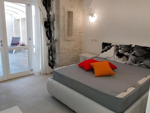 Katil atau katil-katil dalam bilik di Casale Porto Contessa