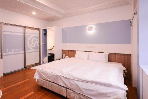 Ein Bett oder Betten in einem Zimmer der Unterkunft Guest Motel-Zhubei