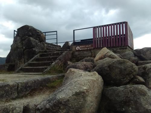 a train on top of a mountain with rocks at Casa Feijao - Alojamento Local in Geres