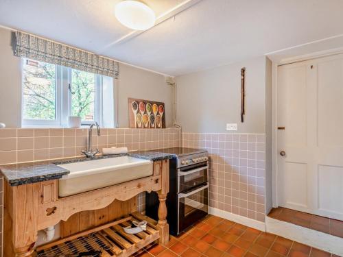 a kitchen with a sink and a stove at 4 Bed in Snettisham oc-kt124 in Snettisham