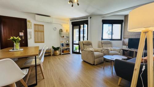 a living room with a couch and a table at Calpe Star in Calpe