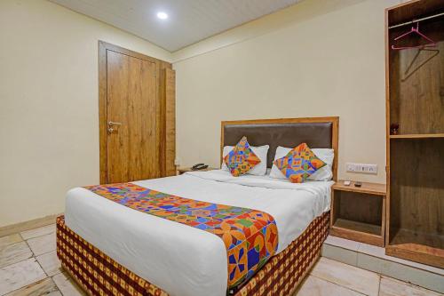 a bedroom with a large bed in a room at Via Maahi Residency in Mumbai