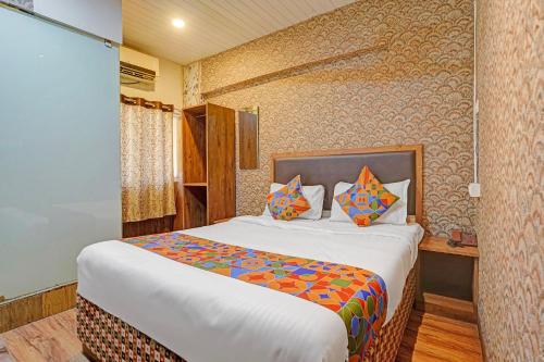 a bedroom with a bed in a room at Via Maahi Residency in Mumbai