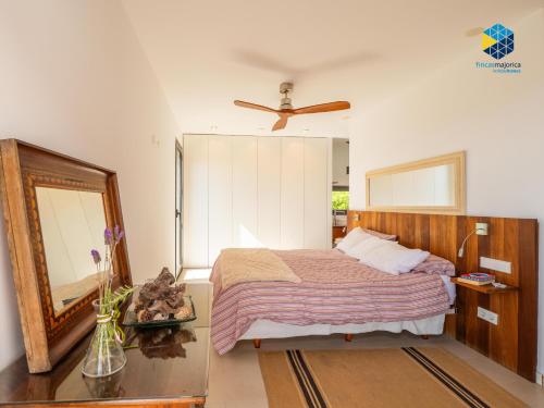 a bedroom with a bed and a mirror at Villa Cata in Esporles