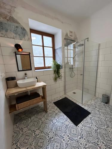 a bathroom with a sink and a shower at Danube Atelier - The Garden in Rossatz