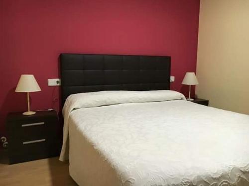 Postel nebo postele na pokoji v ubytování La Laguna