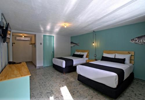 Postel nebo postele na pokoji v ubytování Mas Basico Hotel