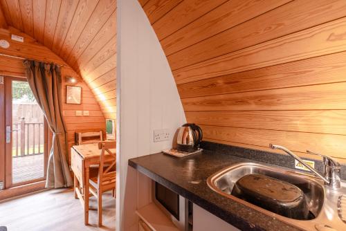 a kitchen with a sink in a tiny house at YHA Stratford-Upon-Avon in Stratford-upon-Avon