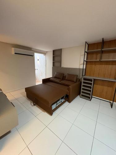 a room with a bed and a couch in it at Apartamento Centro Campina Grande in Campina Grande