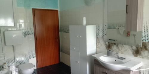 a bathroom with a sink and a toilet at I Ponti in Fanano