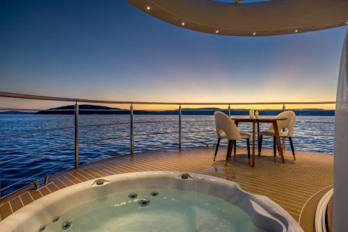 a bath tub sitting on the deck of a yacht at Luxury Floating Apartment - Amor in Split