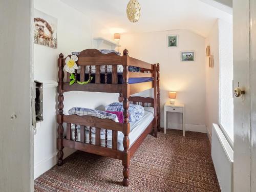 a bedroom with two bunk beds in a room at Hendy in Llanfaelrhys