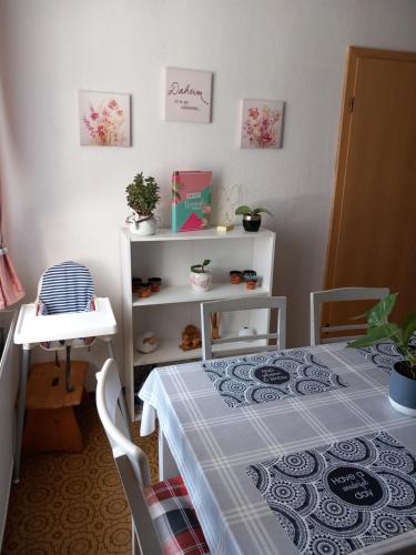 a room with a table with a blue and white table cloth at Ferien- und Monteurwohnung Kieß in Röthenbach