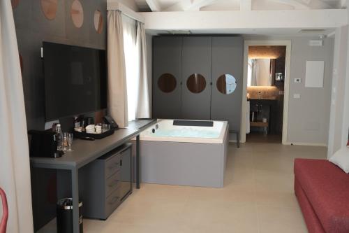 a bathroom with a bath tub in a room at Villa Helena in Limone sul Garda