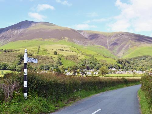 a road with a sign on the side of a mountain at Swallow's Nest - E3245 in Crackenthorpe