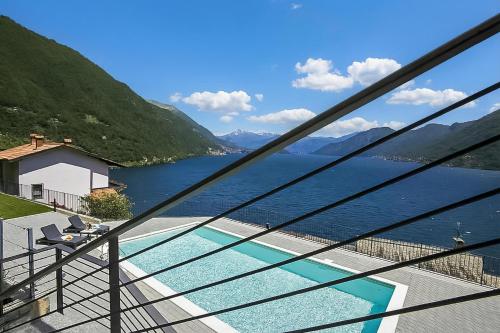 a view of a lake from a balcony at Residence degli Oleandri 2A in Argegno