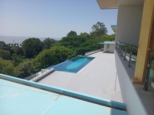 a swimming pool on the roof of a house at Gorgora Eco Resort in Gorgora