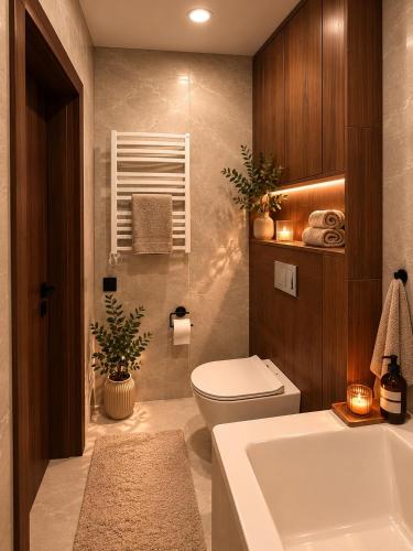 a bathroom with a tub and a toilet and a sink at Luxury apartment in Vilnius