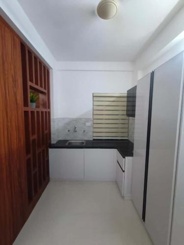 a kitchen with a sink and a counter top at Kalpaka lee divine in Guruvāyūr