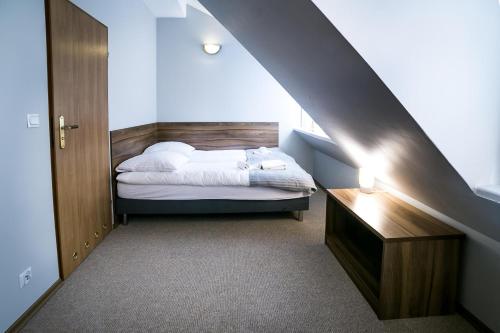 Postel nebo postele na pokoji v ubytování Gościniec Lizawka