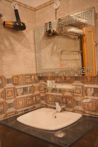 a bathroom with a sink and a counter top at Burj A Zafar in Murree