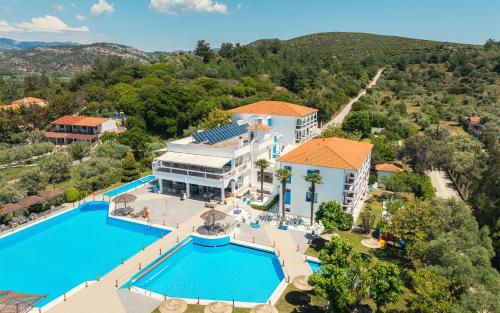 an aerial view of a resort with a swimming pool at Kamari Beach Hotel in Potos