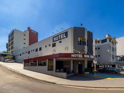 a hotel on the side of a street at Hotel Boa Vista by Carlton in Americana