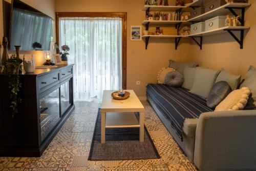 a living room with a couch and a table at Kouzelný domeček in Ostrava
