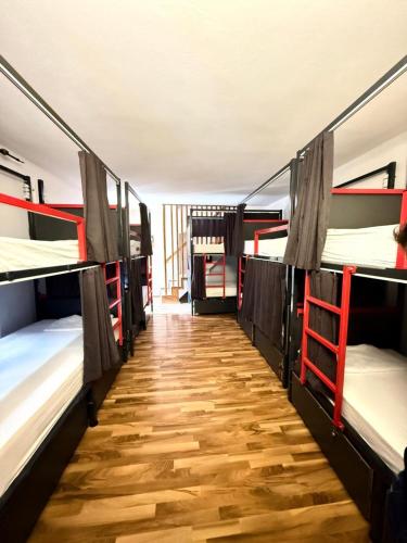 a hallway with several bunk beds in a room at Majka Guest House in Kotor