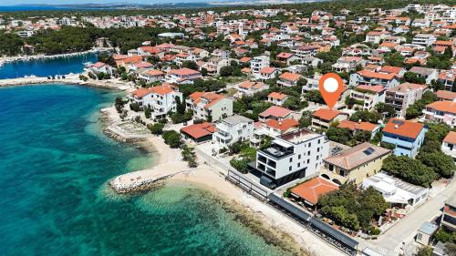 an aerial view of a city next to the ocean at Apartments Lea in Mandre