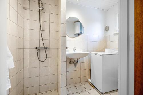 a bathroom with a shower and a sink at Summer House Near The Sea And Good Experiences in Børkop