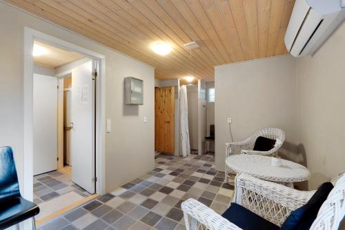 a living room with wicker chairs and a table at Beautiful House 1St Row To The Water in Fur