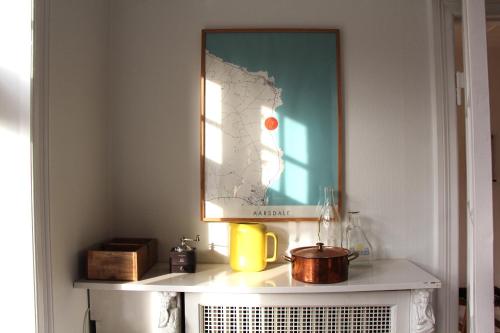 a picture on top of a shelf in a room at Summer House In Årsdale With A Beautiful Sea View in Svaneke