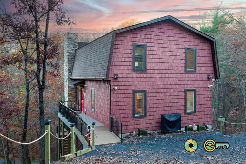 a pink house with a ramp leading up to it at 324 Brian Drive: The Swirling Bird in Basye