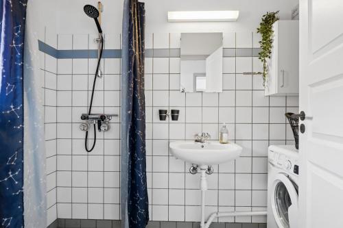 a bathroom with a shower and a sink at Holiday Apartment With Pool On Bornholm in Gudhjem