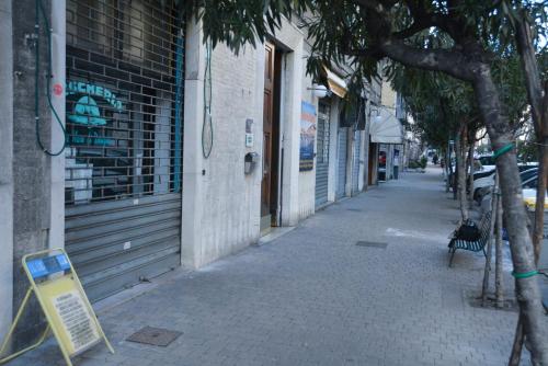 a street with a sign on the side of a building at Le Veneri Del Golfo in La Spezia