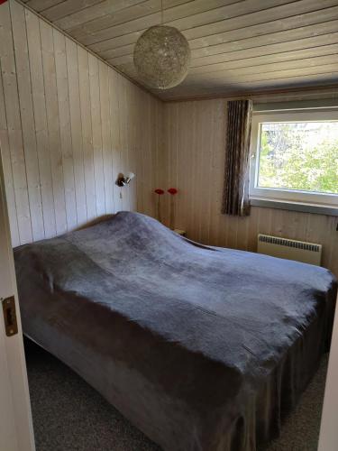 a bedroom with a large bed in a room at Fantastic Spa Holiday Home in Hemmet