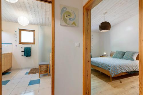 a bedroom with a bed in a room at Gite Le Koto in Thorigny
