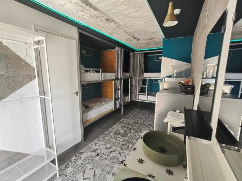 a bathroom with a green tub in a room at "The Sisters' Hostel" the women only hostel in Adeje