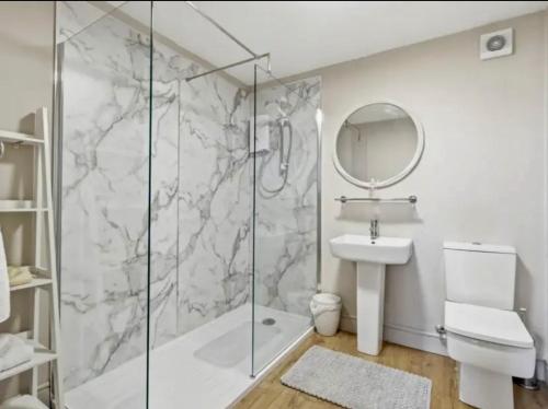 a bathroom with a shower and a sink at Blenkinsopp Castle Inn in Greenhead